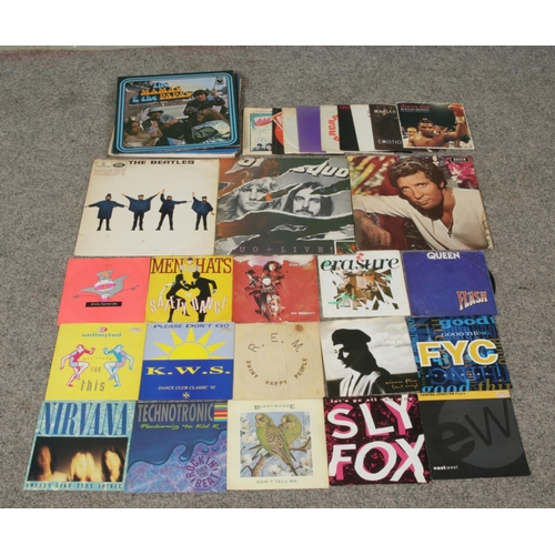 A collection of singles and album vinyl records, to include The Beatles ...