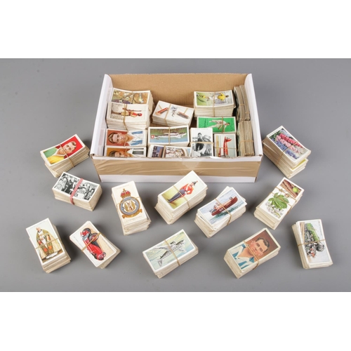 A box of cigarette cards including full sets with examples by Players
