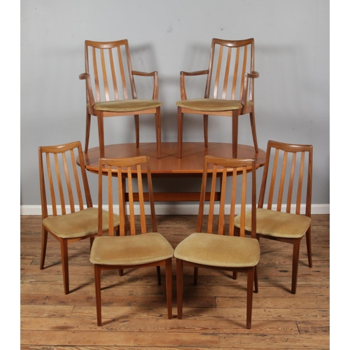 A mid-twentieth century G-Plan oval extending dining table, with six G-Plan Fresco dining chairs, including two carvers. Dimensions of table (closed): Height: 72cm, Width: 152cm, Depth: 100cm.