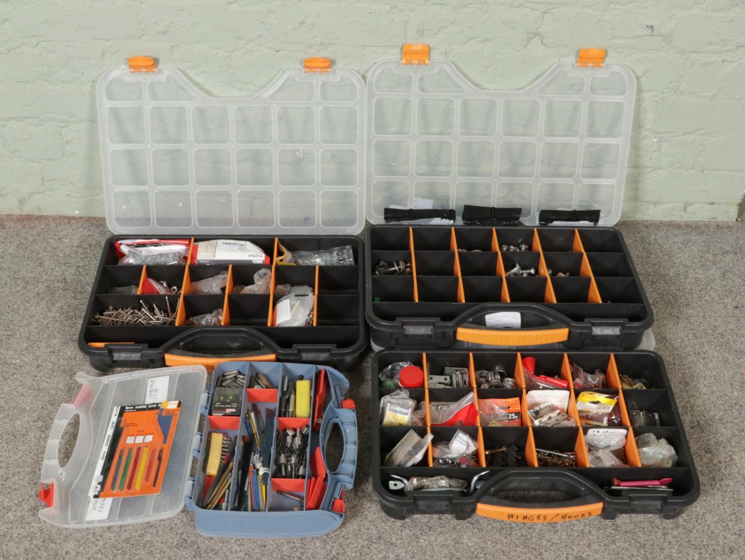 Four workboxes of DIY and tool accessories. Consisting of drill and ...