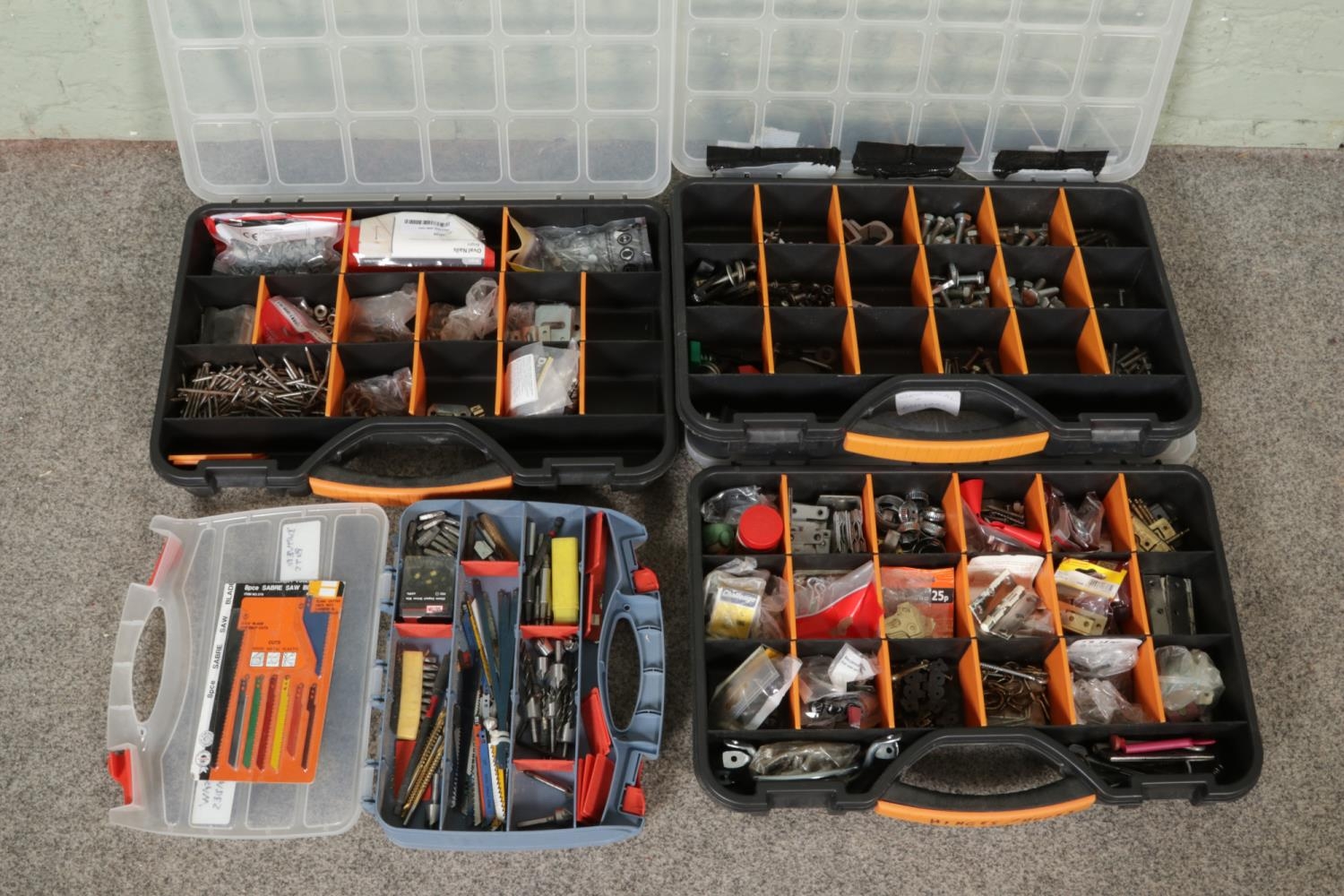 Four workboxes of DIY and tool accessories. Consisting of drill and ...