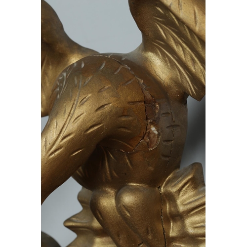219 - An antique Regency style giltwood convex wall mirror. With carved eagle and ball frieze. Length 91cm... 