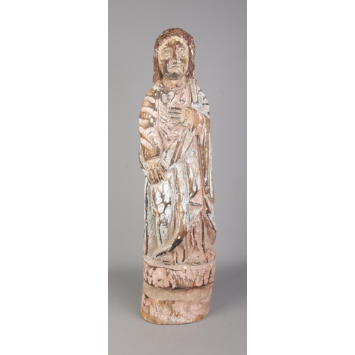 121 - A South American Spanish colonial carved wooden Santos statue. Height 65cm.
