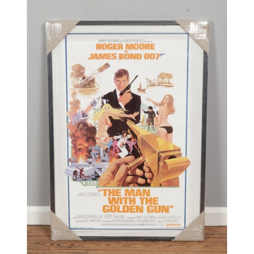 137 - A framed James Bond 007 The Man With The Golden Gun poster. Published by Loeb, copyright 1974. 97cm ... 