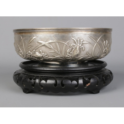 146 - A late 19th/early 20th century Chinese silver bowl with embossed decoration depicting crabs and rice... 