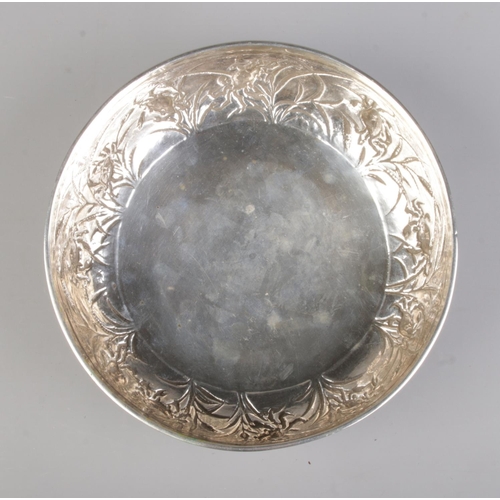 146 - A late 19th/early 20th century Chinese silver bowl with embossed decoration depicting crabs and rice... 