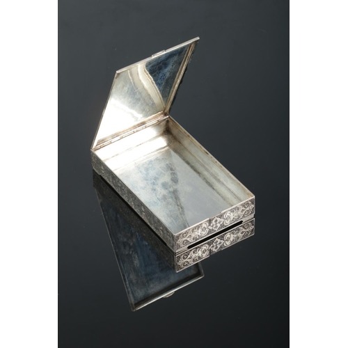 149 - A Persian silver box with extensive engraved decoration. The hinged lid with central enamelled panel... 