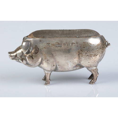 153 - An Edwardian silver pin cushion modelled as a pig. Assayed Birmingham 1905 by Adie & Lovekin Ltd. He... 