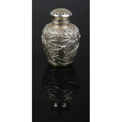 154 - A Chinese silver pepperette. Decorated with bamboo and birds. Retailed by Luen Wo, Shanghai. Height ... 