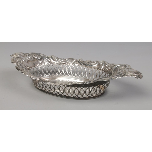 155 - An Edwardian silver basket with pierced and repousse decoration. Assayed Birmingham 1902 by Charles ... 