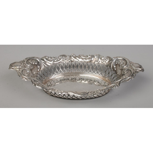 155 - An Edwardian silver basket with pierced and repousse decoration. Assayed Birmingham 1902 by Charles ... 
