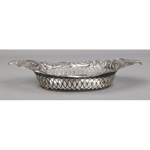 155 - An Edwardian silver basket with pierced and repousse decoration. Assayed Birmingham 1902 by Charles ... 