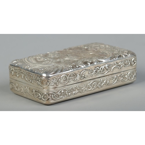 156 - An Edwardian silver box. With repousse decoration depicting a married couple departing in a horse dr... 