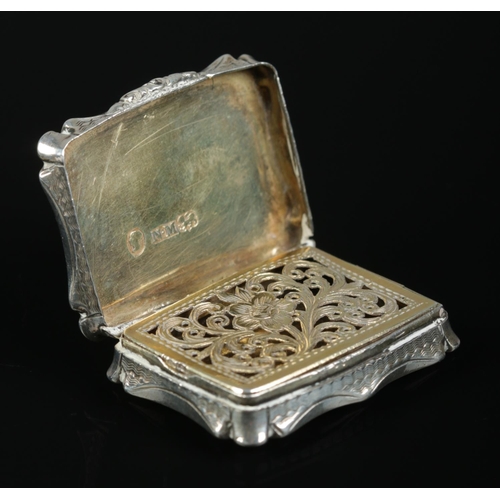 161 - A Victorian silver vinaigrette. With engraved decoration to outer case and gilt foliate grill to int... 