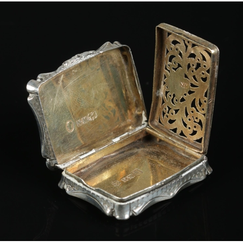 161 - A Victorian silver vinaigrette. With engraved decoration to outer case and gilt foliate grill to int... 