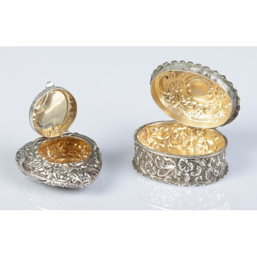 163 - Two silver pill boxes with repousse decoration. Heart shaped example assayed Birmingham 1898 by Jose... 