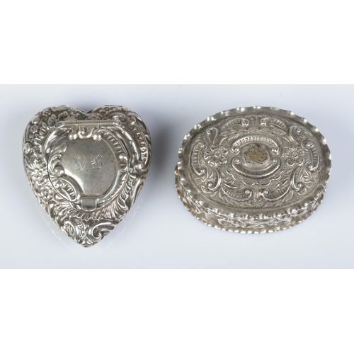 163 - Two silver pill boxes with repousse decoration. Heart shaped example assayed Birmingham 1898 by Jose... 