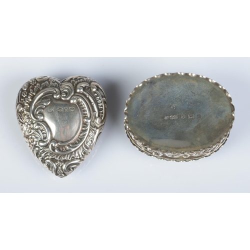 163 - Two silver pill boxes with repousse decoration. Heart shaped example assayed Birmingham 1898 by Jose... 