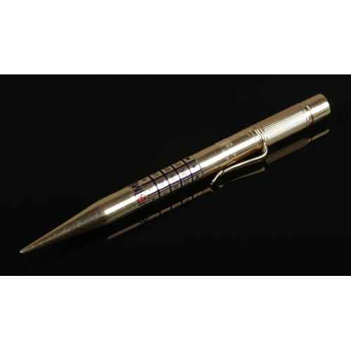 170 - An 18ct gold propelling pencil by Goldsmiths & Silversmiths Company Ltd, with enamelled rotating cal... 