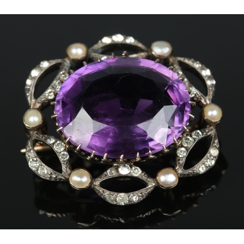 177 - A Victorian 9ct gold Amethyst, seed pearl and paste brooch. Amethyst 1.7cm x 2cm. 8.2g.