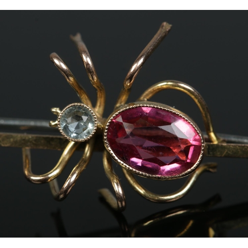 182 - A 9ct yellow gold spider bar brooch, the head and body set with coloured faceted stones. Length 6.5c... 