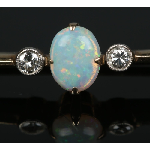184 - A 9ct yellow gold and platinum opal and diamond bar brooch. Length 5.5cm. 3.78g.