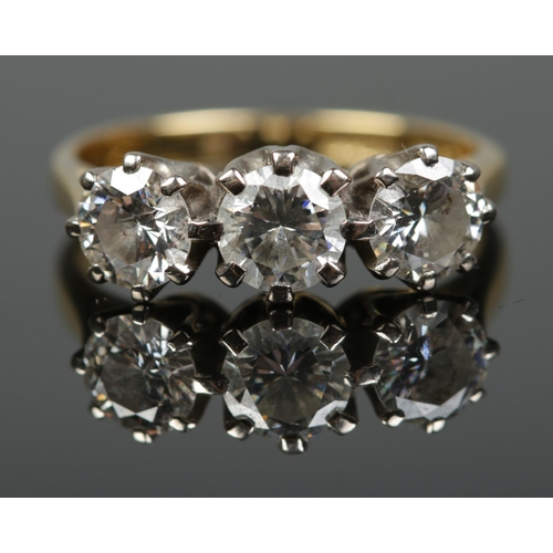 190 - An 18ct gold three stone diamond trilogy ring. Approximately 1.5ct diamond total. Size M. 4.22g.