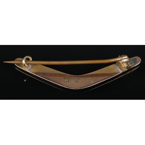195 - A Victorian 9ct gold and enamel boomerang brooch, Return To Me. 2.39g.