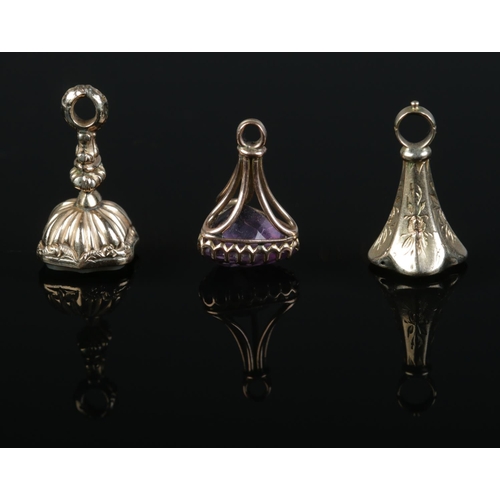 203 - Three Victorian gold charms/fobs, all set with coloured stones. 4.43g.