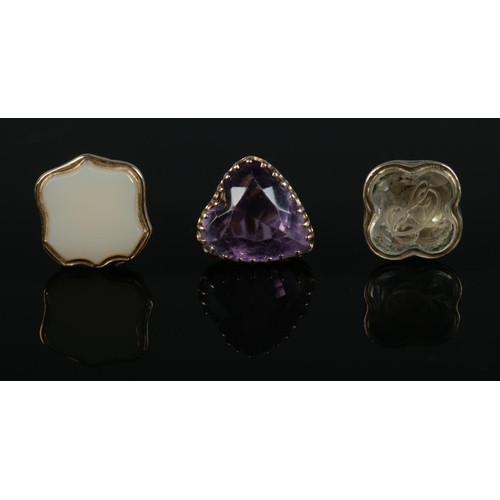 203 - Three Victorian gold charms/fobs, all set with coloured stones. 4.43g.