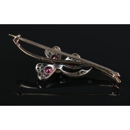 208 - A 15ct gold floriform bar brooch set with diamonds, rubies and a central pearl. Seed pearl approxima... 