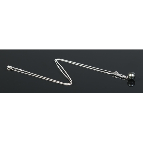 209 - A 9ct white gold and diamond Tahiti pearl ring, along with a similar pendant on 9ct white gold chain... 