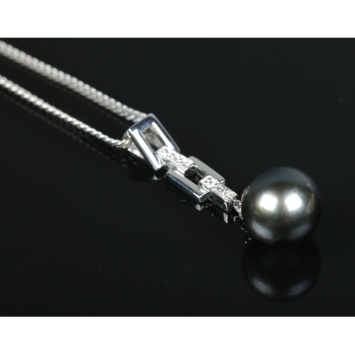 209 - A 9ct white gold and diamond Tahiti pearl ring, along with a similar pendant on 9ct white gold chain... 