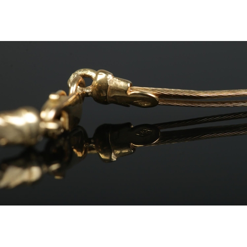213 - A 9ct gold three band necklace with ball decoration. Makers stamp IBB. 4.04g.
