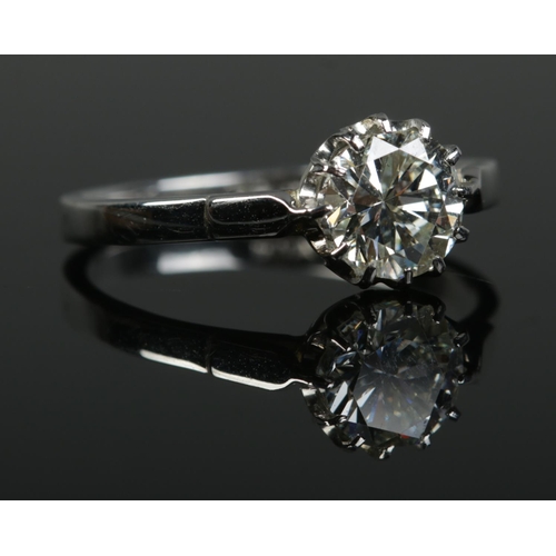 214 - A platinum and diamond solitaire ring. Set with a round brilliant cut diamond. Diamond weight 1.61ct... 