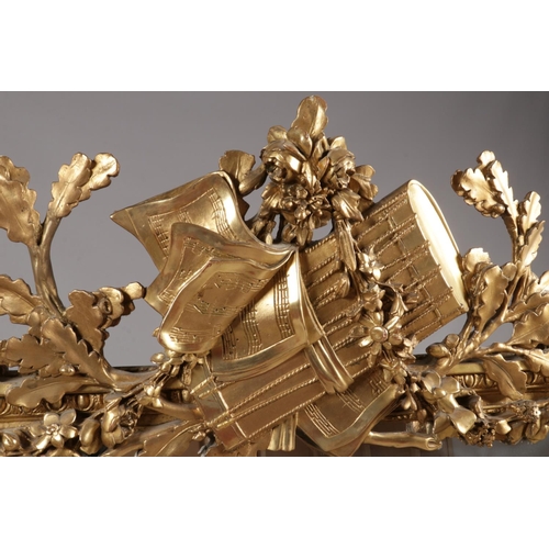 230 - A large 19th century gilt framed pier mirror. Surmounted with music sheets, drum, acanthus leaves an... 