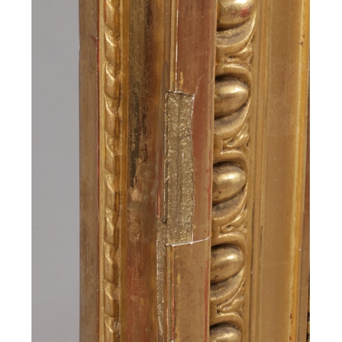 230 - A large 19th century gilt framed pier mirror. Surmounted with music sheets, drum, acanthus leaves an... 