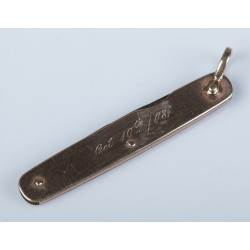 172 - A gold double folding pen knife made in Sheffield. With presentation inscription dated 1908. Length ... 