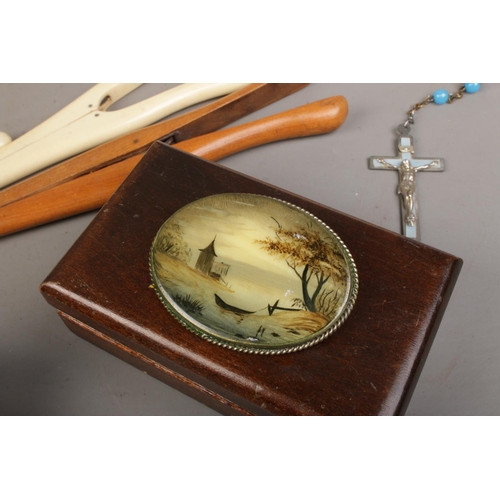 26 - A collection of assorted items to include a Mother Of Pearl hand painted brooch, a collection of car... 