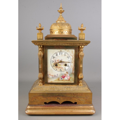 53 - A French brass and porcelain face mantel clock with hand painted porcelain dial signed Morot. On woo... 