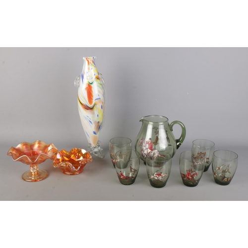 105 - A collection of art glass; A handblown multicoloured glass fish vase/sculpture, two similar orange c... 