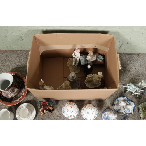 122 - A box of assorted items, to include onyx bodied Aztec warrior figure, a quantity of figures produced... 