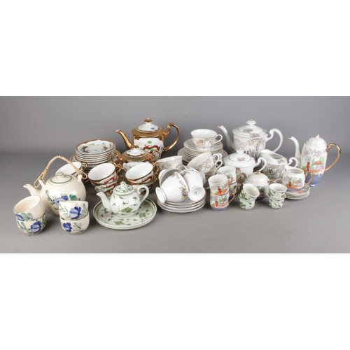 158 - A quantity of oriental part tea sets including geisha cup examples