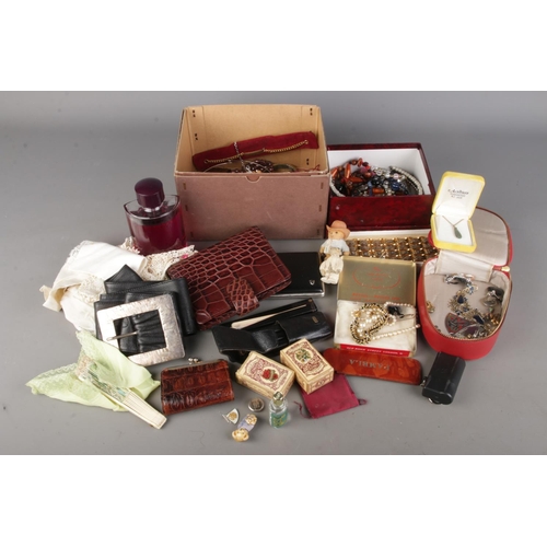 169 - A box of ladies accessories including costume jewellery, purses, belts, leather pouches, perfume etc
