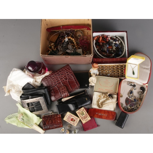 169 - A box of ladies accessories including costume jewellery, purses, belts, leather pouches, perfume etc
