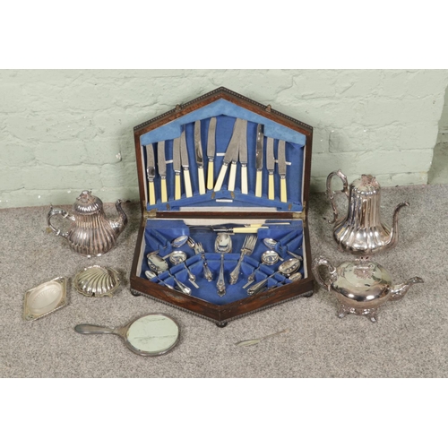 123 - A box of assorted silver plated items to include Skinner & Co. tea pot, mixed tea wares and a Lecler... 
