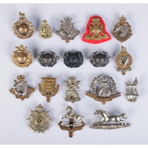 61 - A collection of military cap/collar badges; Two Royal Marine Badges, A British Army 3rd Hussars regi... 