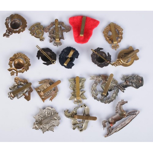 61 - A collection of military cap/collar badges; Two Royal Marine Badges, A British Army 3rd Hussars regi... 