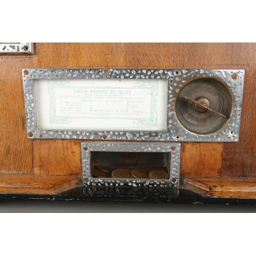 2 - An oak cased 1930's Bryan's 'Sixwin' clock penny arcade spinning game, with ebonised top panel. Stam... 