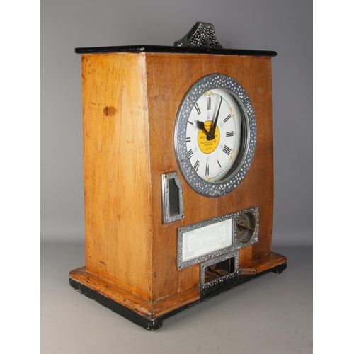 2 - An oak cased 1930's Bryan's 'Sixwin' clock penny arcade spinning game, with ebonised top panel. Stam... 